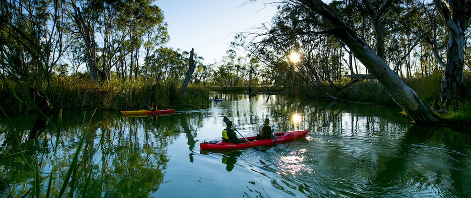 Two people in a kayak on the river Murray